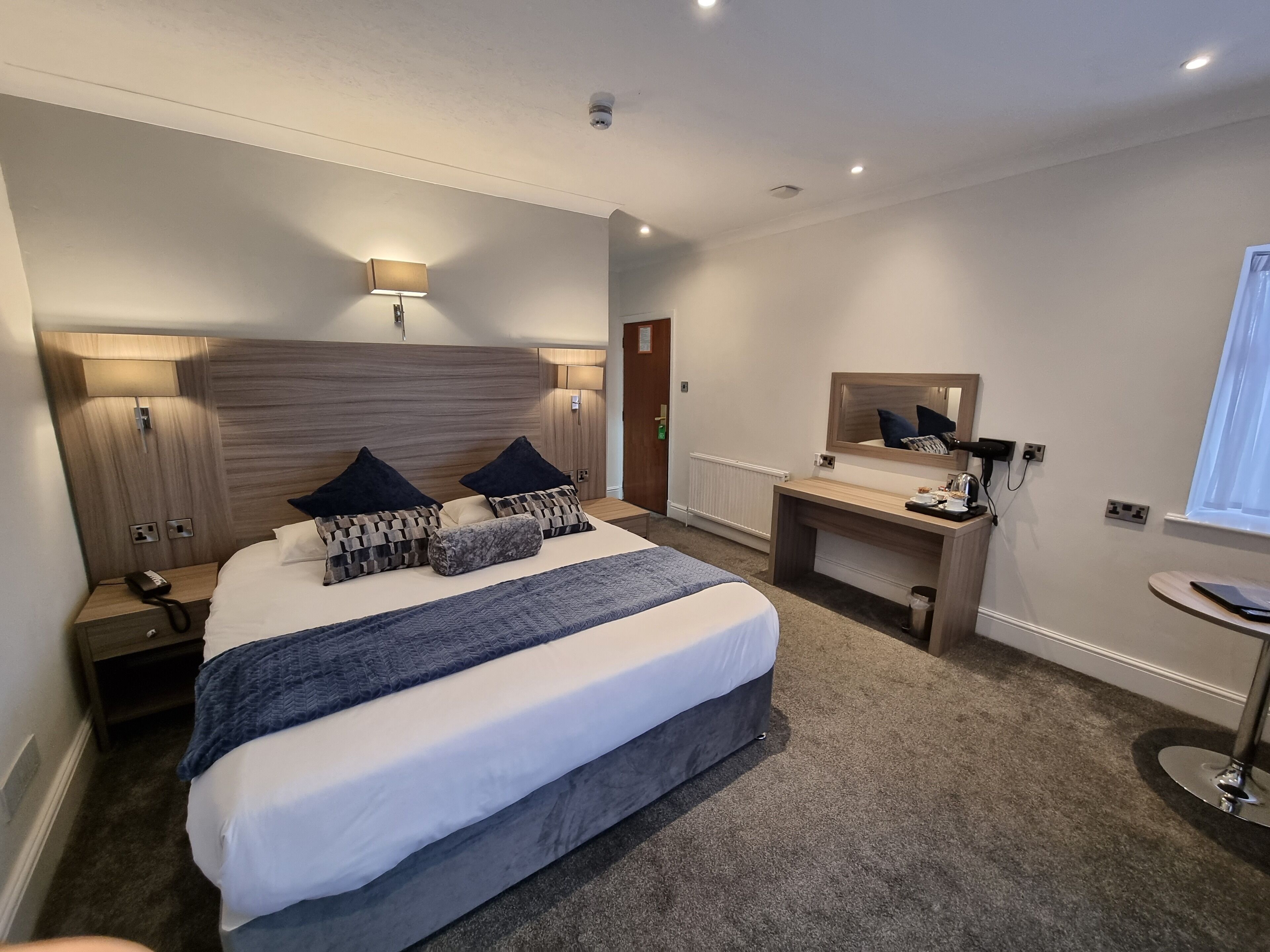 Premium bedding, desk, laptop workspace, iron/ironing board