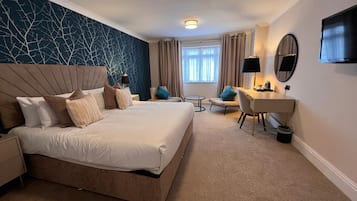 Premium bedding, desk, laptop workspace, iron/ironing board