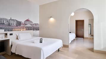 A hotel room with two beds, a large window with a cityscape view, a wooden floor, and a door leading to another room.