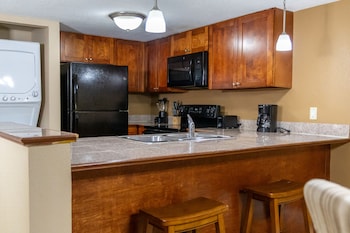 Suite, 2 Bedrooms | Private kitchen | Microwave, coffee/tea maker at Legacy Vacation Resorts - Kissimmee/Orlando