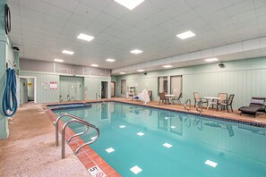 Indoor pool, open 8:00 AM to 11:00 PM, pool loungers