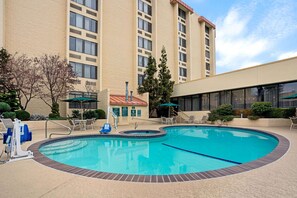 Seasonal outdoor pool, open 10:00 AM to 10:00 PM, pool umbrellas