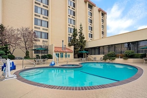 Seasonal outdoor pool, open 10:00 AM to 10:00 PM, pool umbrellas