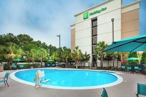 Outdoor pool, open 9:00 AM to 10:00 PM, pool loungers