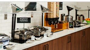 A buffet setup with labeled food stations, including 'Regional Favorites' and 'Fuel Up For The Day!' signs. - Holiday Inn Atlanta-Northlake by IHG (Atlanta)