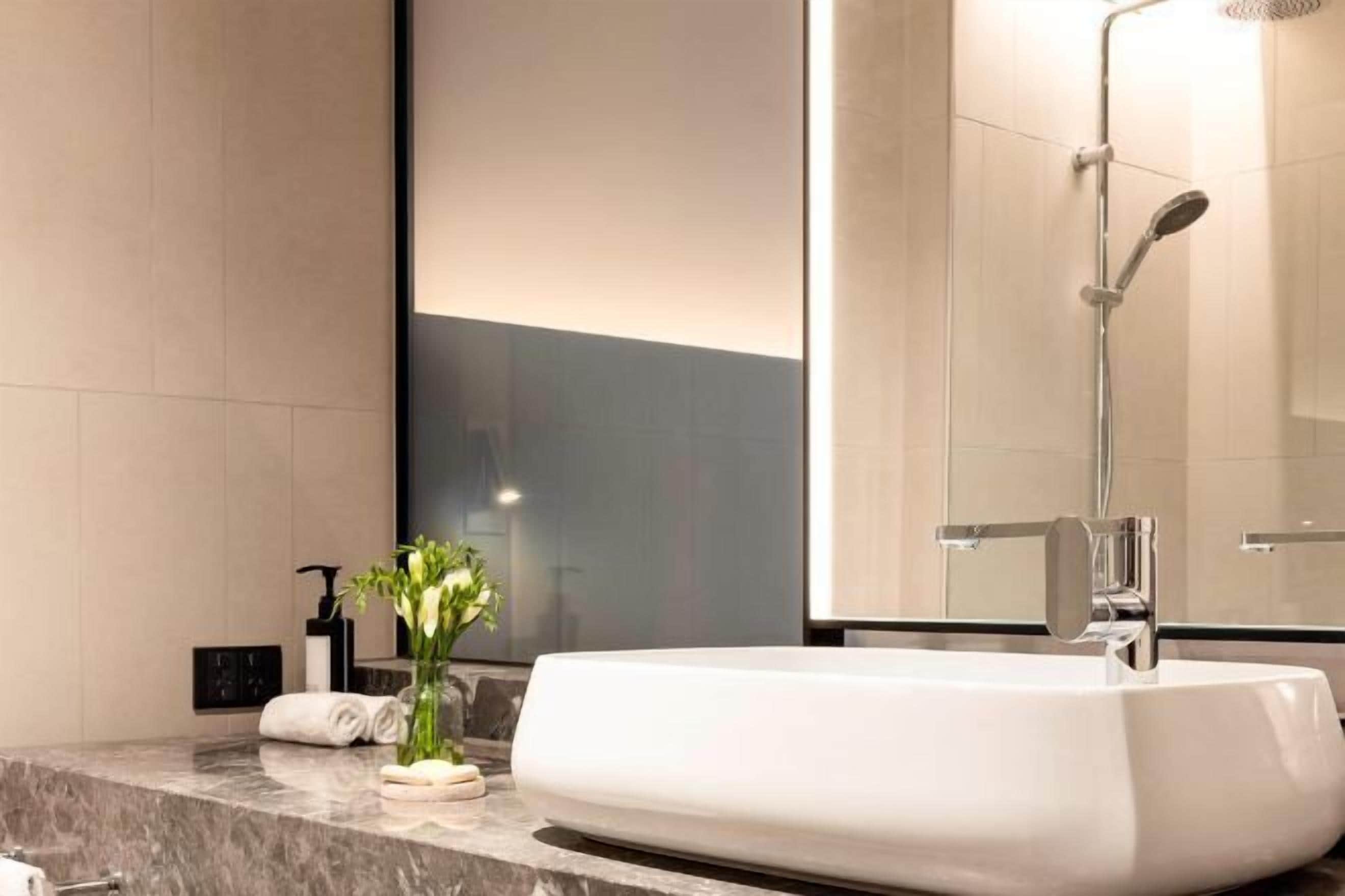 Shower, designer toiletries, hair dryer, bathrobes