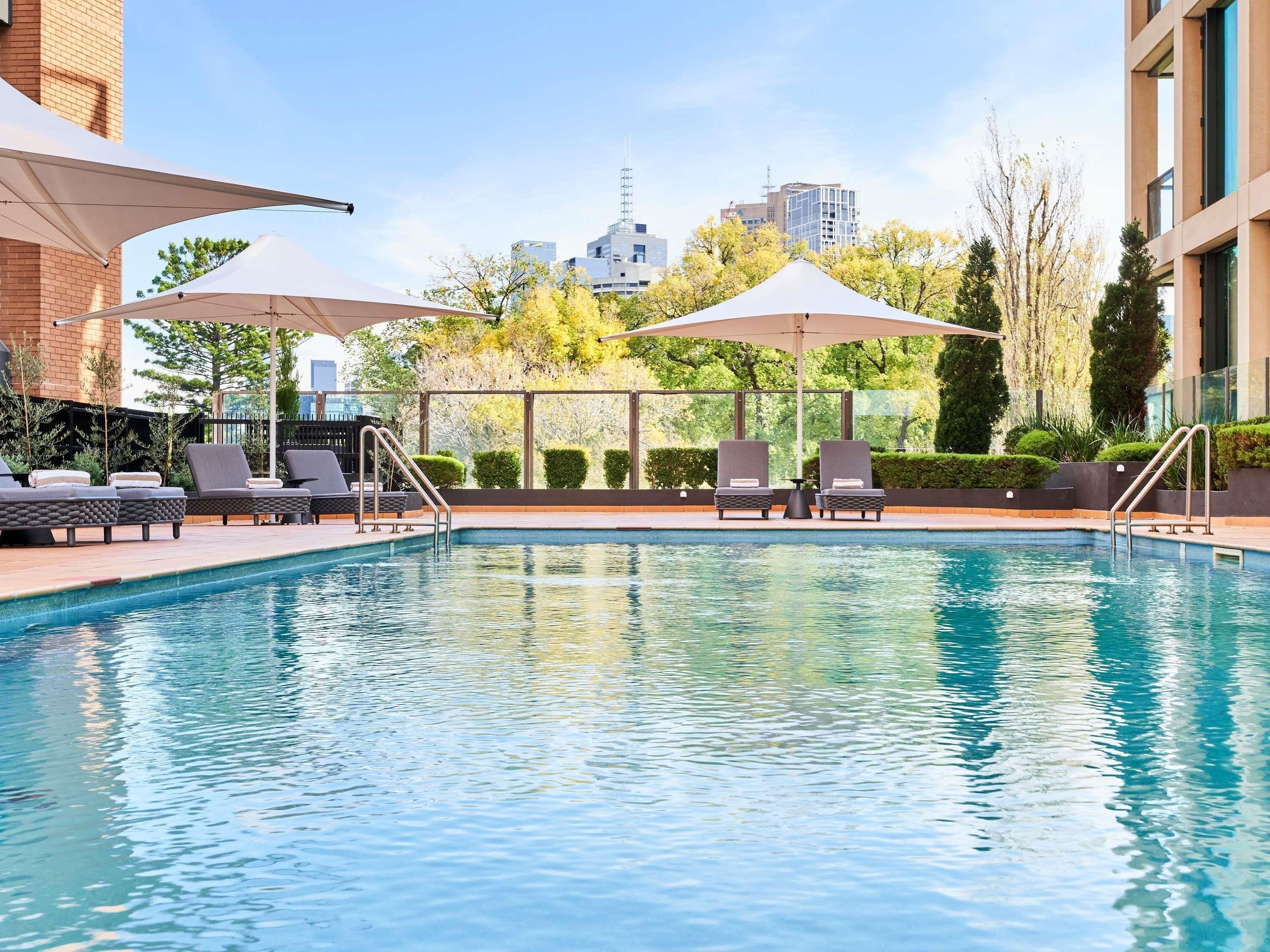 Outdoor pool, pool umbrellas, pool loungers