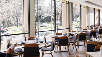 Breakfast, dinner served; local cuisine, garden views