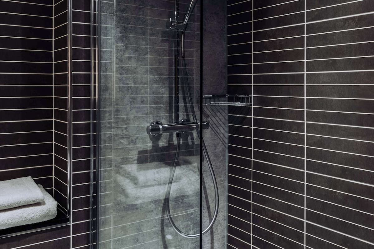 hypo-allergenic bedding, desk, laptop workspace, blackout curtains