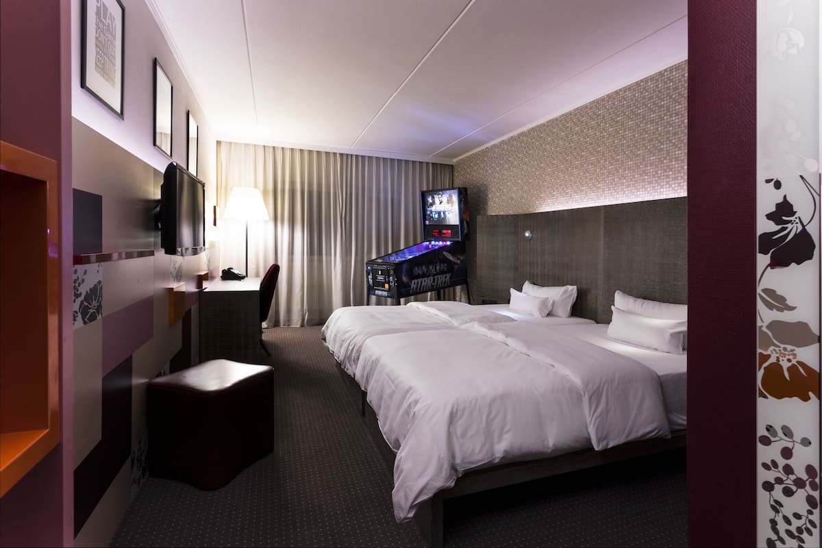 hypo-allergenic bedding, desk, laptop workspace, blackout curtains