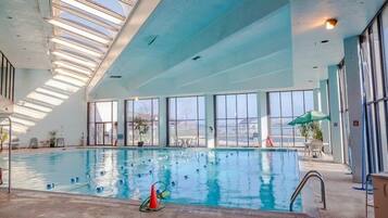 Indoor pool, outdoor pool, open 8 AM to 8 PM, pool umbrellas