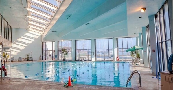 Indoor pool, outdoor pool, open 8 AM to 8 PM, pool umbrellas