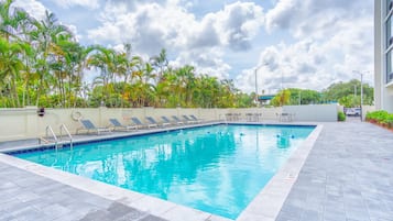 Outdoor pool, open 7:00 AM to 10:00 PM, sun loungers