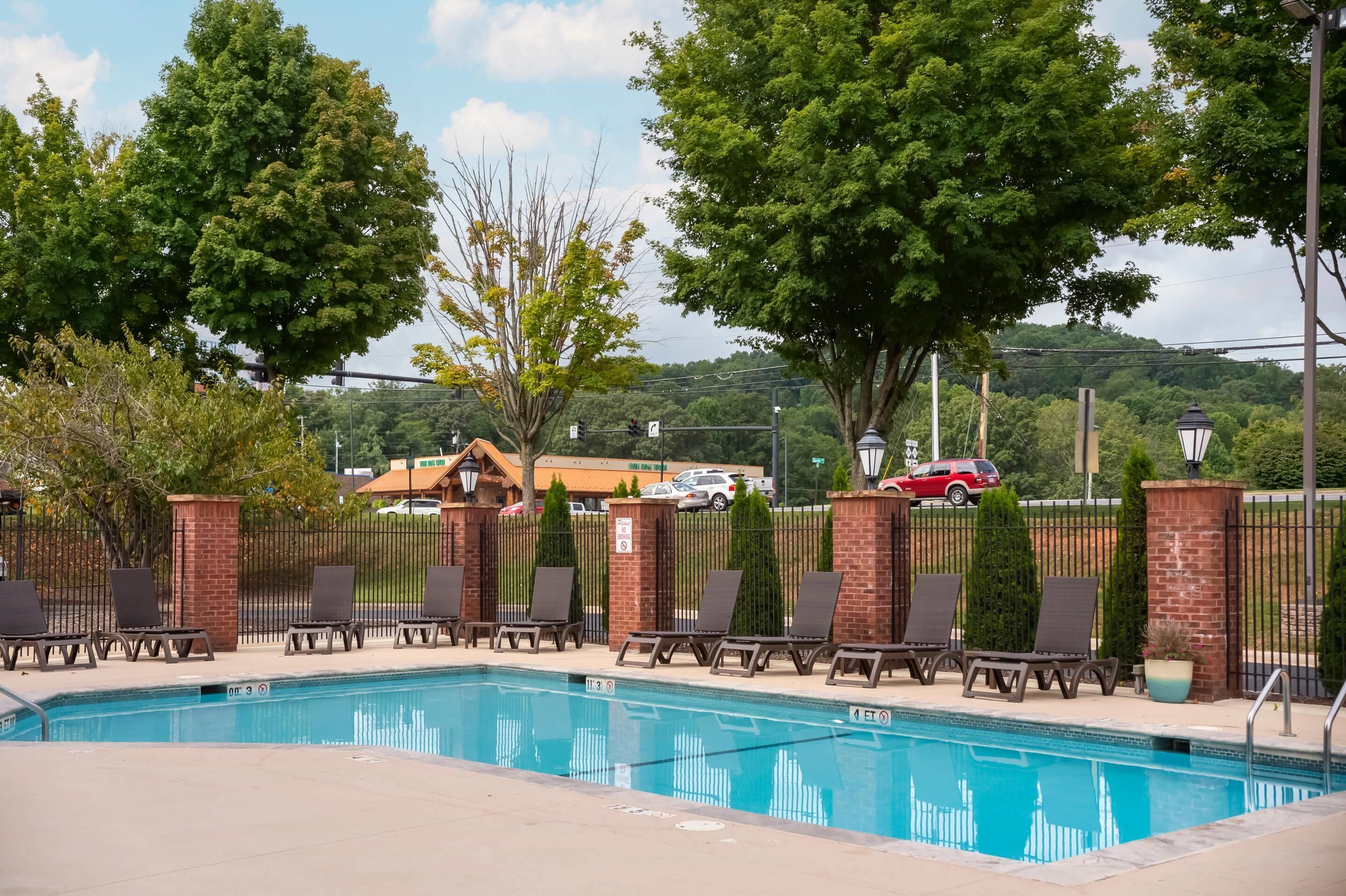 seasonal outdoor pool, open 10:00 am to 10:00 pm, pool umbrellas