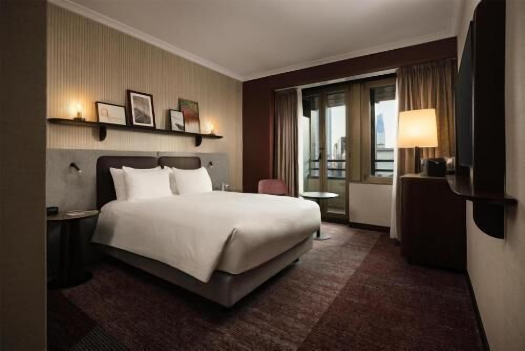 Hypo-allergenic bedding, down comforters, minibar, in-room safe