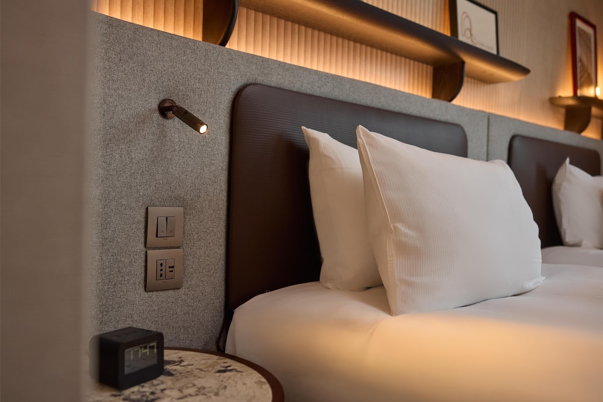 Hypo-allergenic bedding, down comforters, minibar, in-room safe