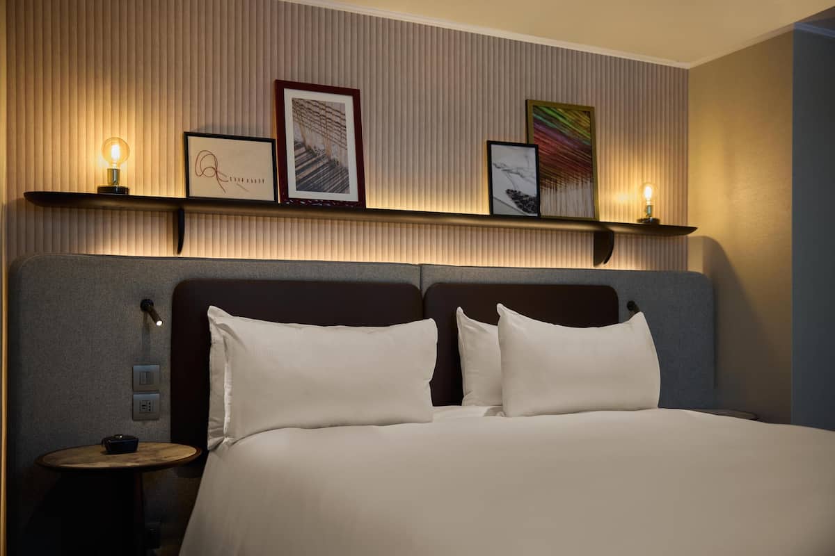 Hypo-allergenic bedding, down comforters, minibar, in-room safe