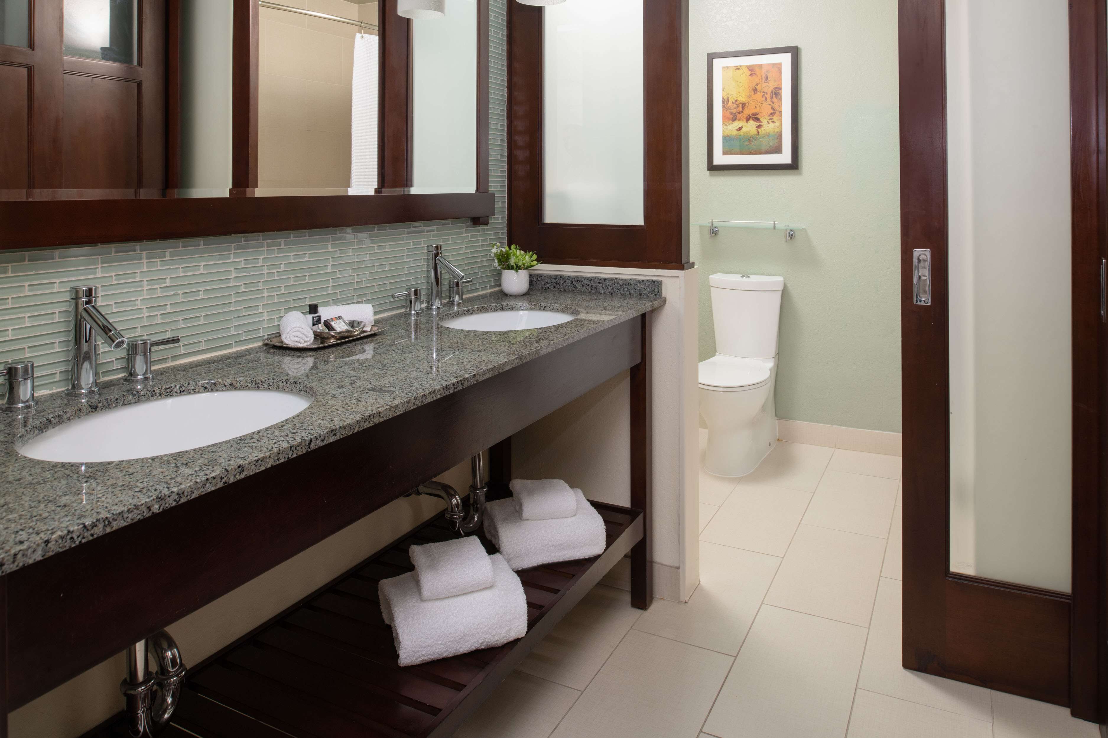 combined shower/bathtub, designer toiletries, hair dryer, bathrobes