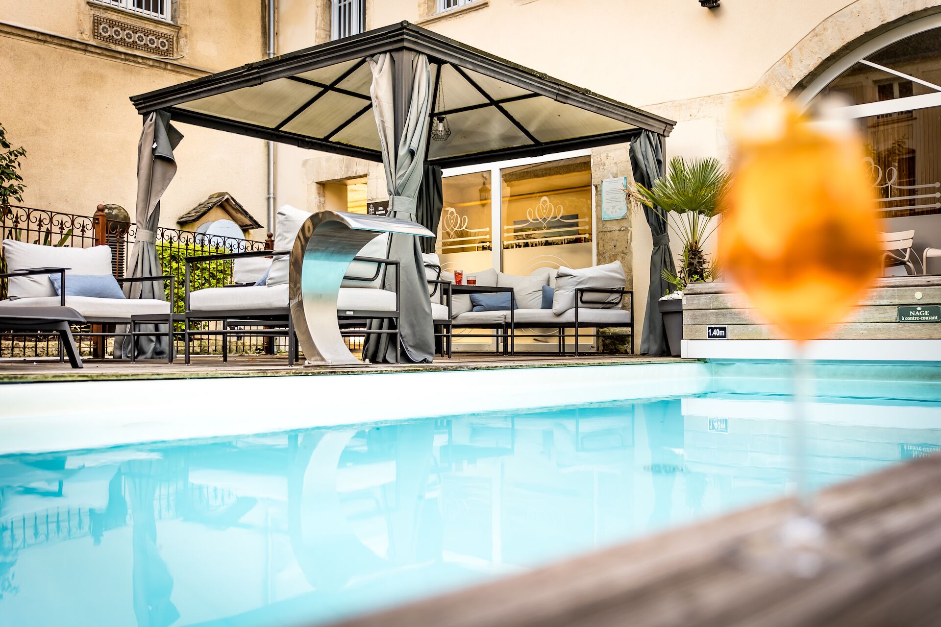 outdoor pool, open 8:00 am to 10:00 pm, pool umbrellas, pool loungers