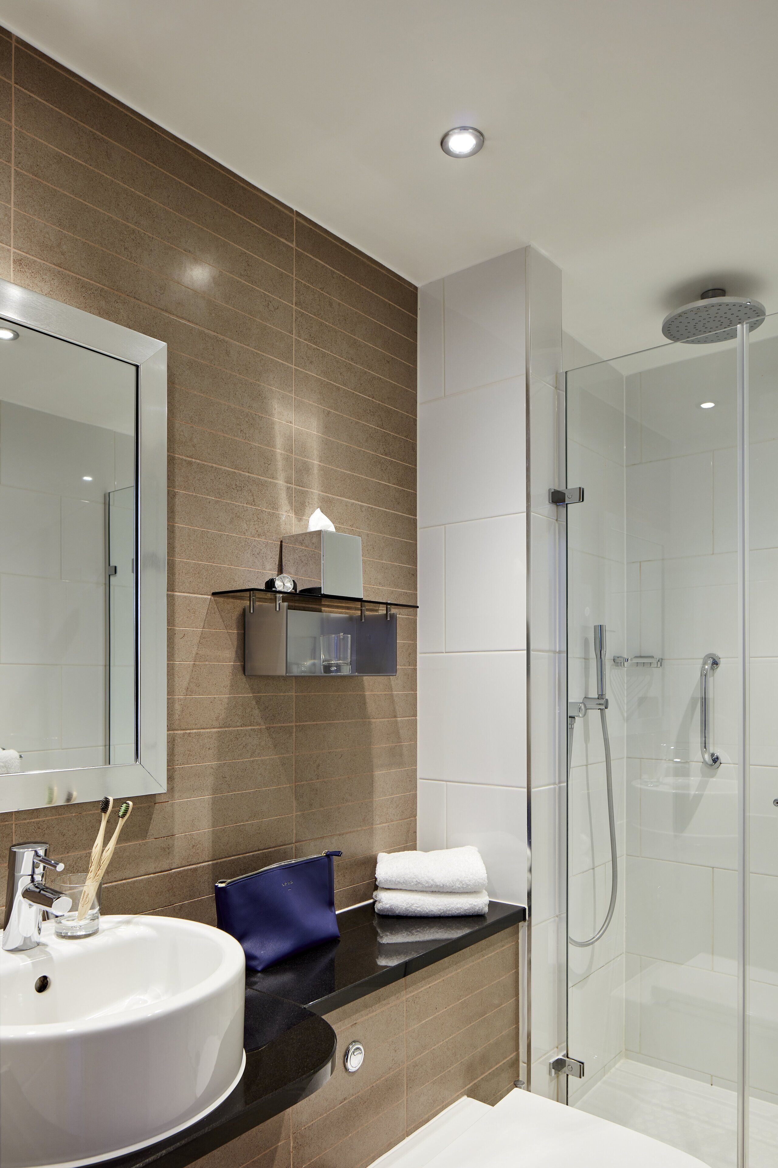 rainfall showerhead, eco-friendly toiletries, hair dryer, towels