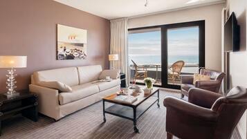 Luxe beddengoed, een minibar, een kluis op de kamer, een bureau