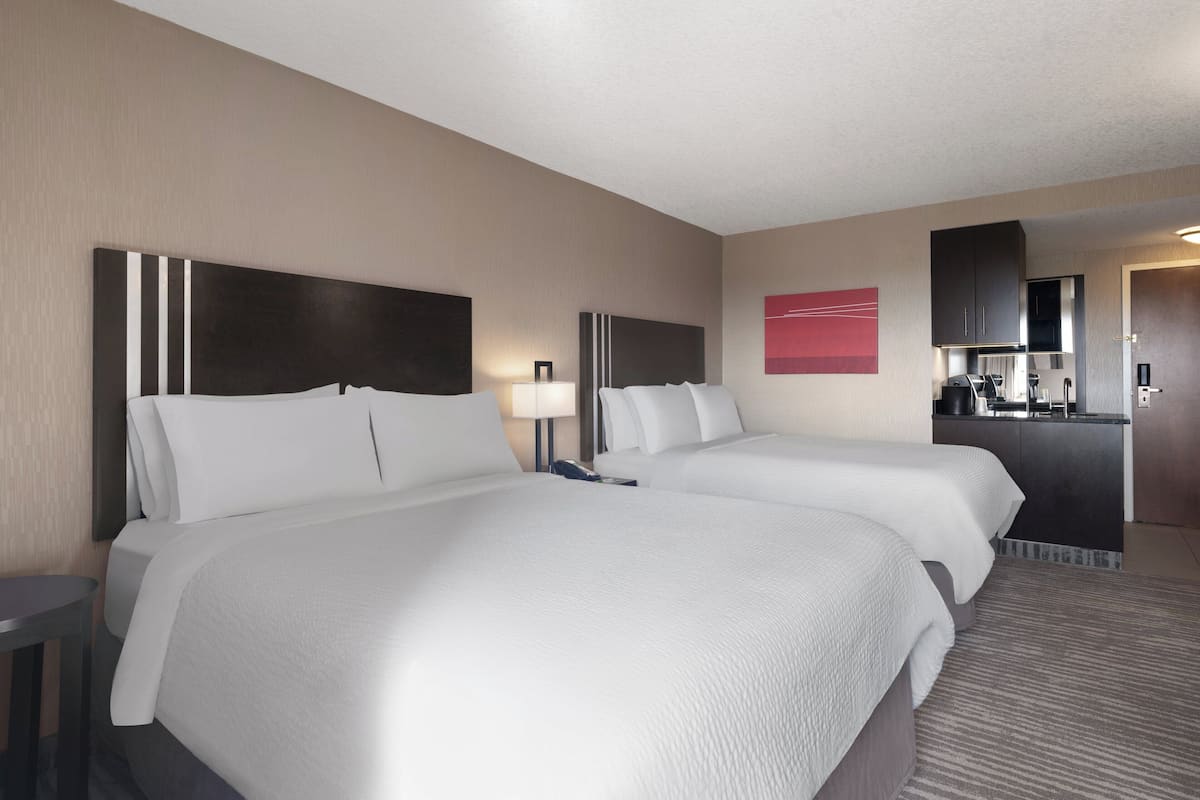 Pillowtop beds, desk, blackout drapes, iron/ironing board