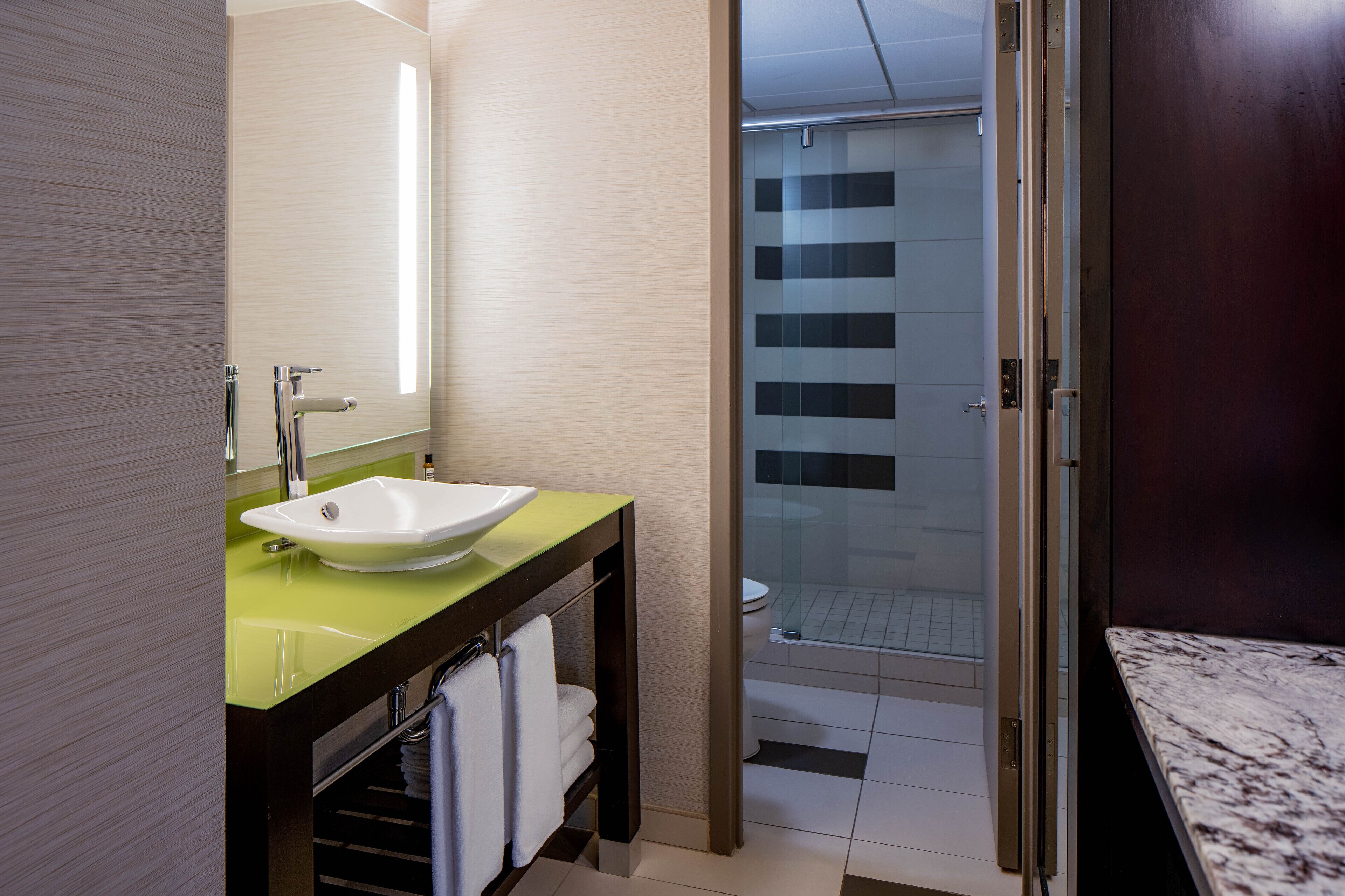 designer toiletries, hair dryer, bathrobes, towels