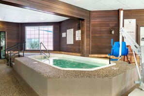Indoor pool, pool umbrellas, sun loungers