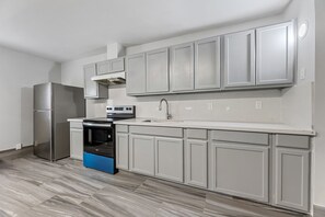 Family Suite, Multiple Beds, Non Smoking | Private kitchen | Full-size fridge, coffee grinder, paper towels, dining tables