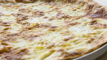 A round pie with a golden-brown crust and a creamy filling.