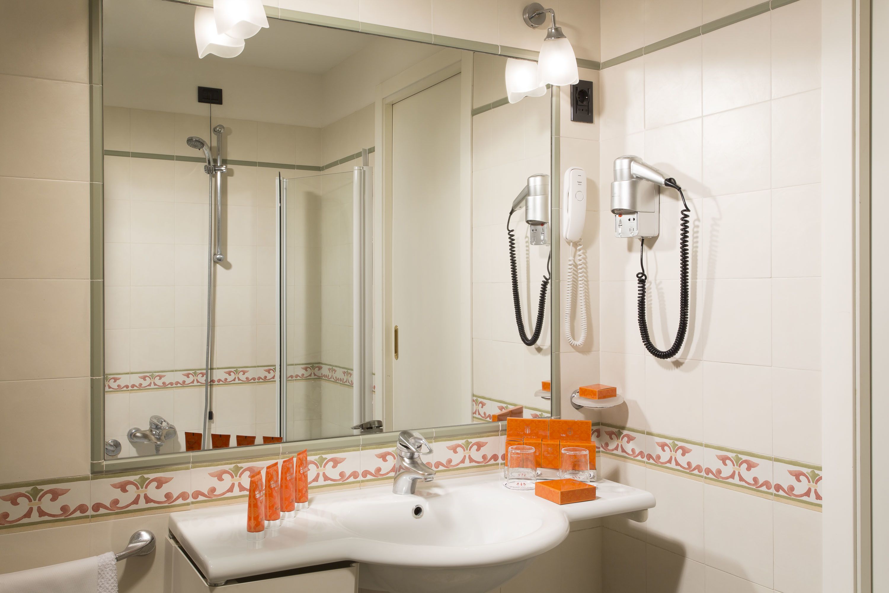 eco-friendly toiletries, hair dryer, bathrobes, slippers