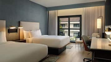 Premium bedding, desk, laptop workspace, iron/ironing board