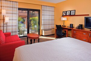 Premium bedding, desk, laptop workspace, iron/ironing board