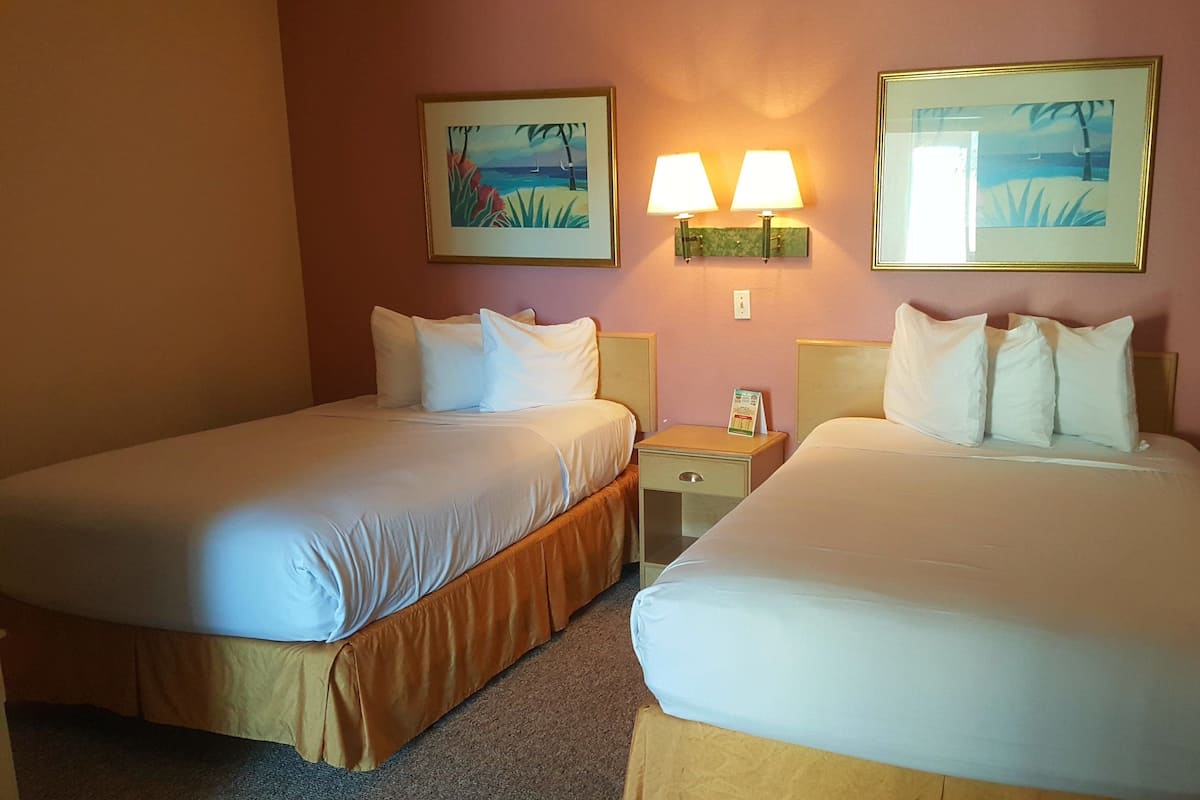 Suite, 2 Double Beds, Kitchenette, Sleeper Sofa & In-Room Safe | In-room safe, WiFi (free), bed sheets