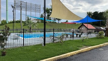 Seasonal outdoor pool, open 9:00 AM to 9:00 PM, pool loungers