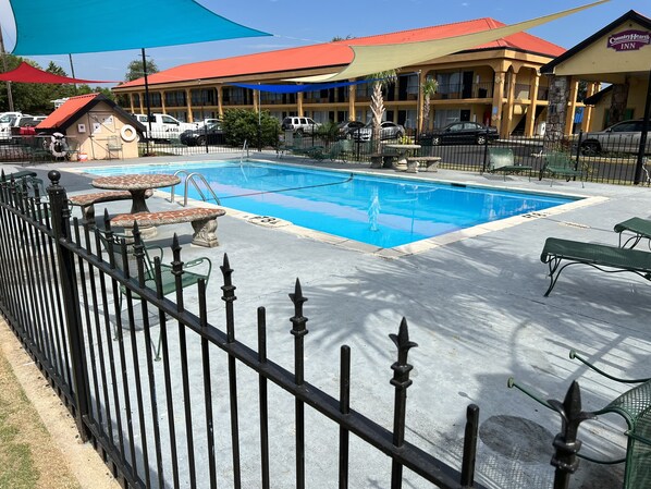 Seasonal outdoor pool, open 9:00 AM to 9:00 PM, pool loungers