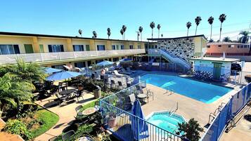 Outdoor pool, open 10 AM to 10 PM, pool umbrellas, pool loungers