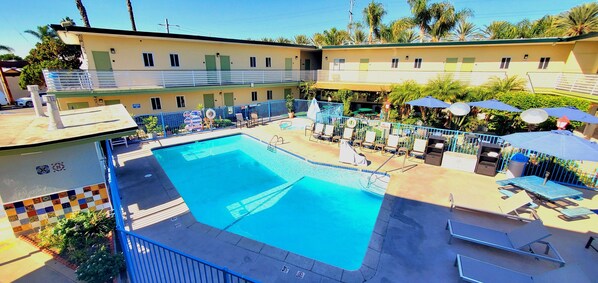 Outdoor pool, open 10 AM to 10 PM, pool umbrellas, sun loungers