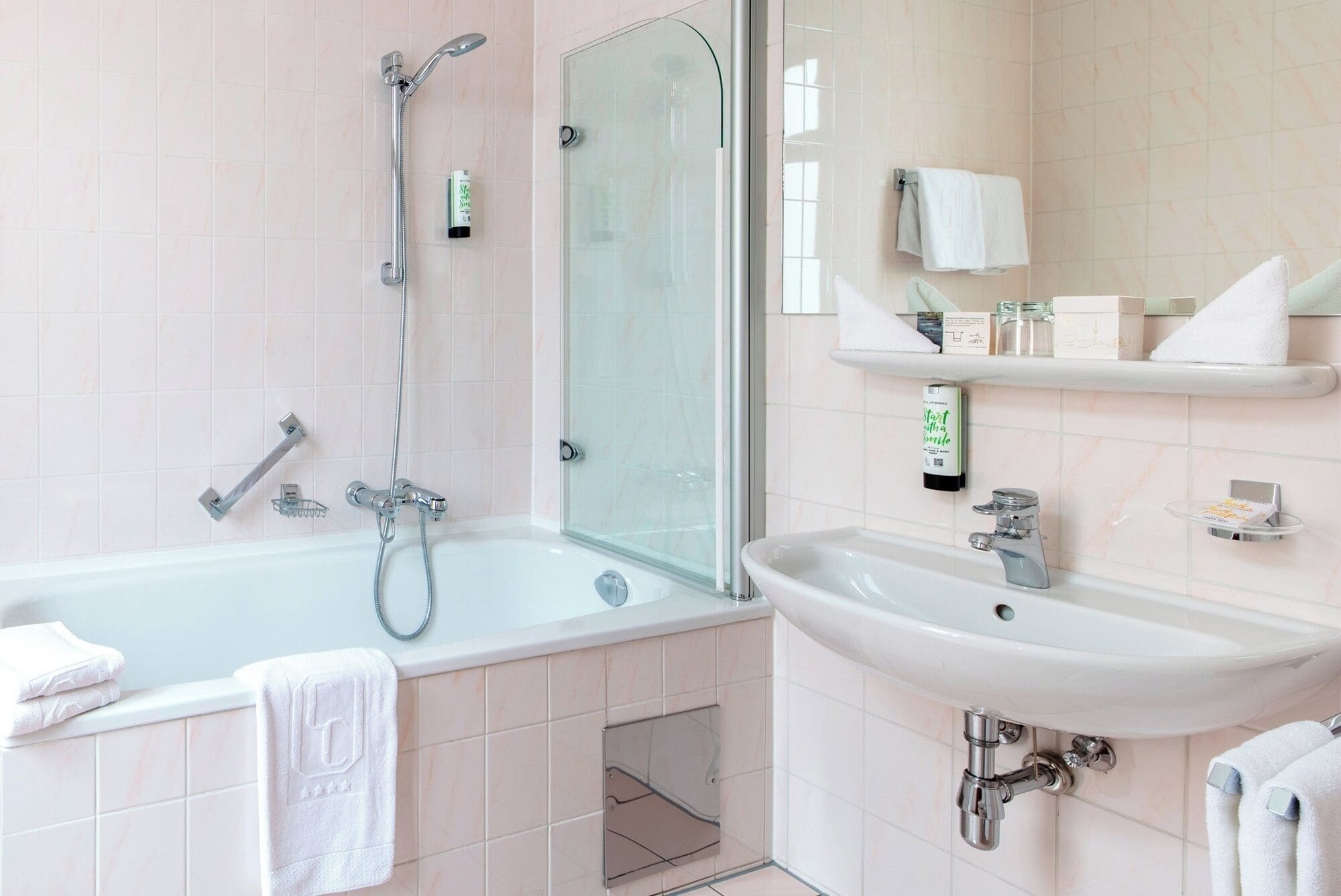 eco-friendly toiletries, hair dryer, towels