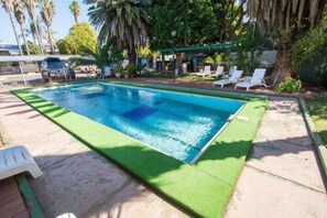 Outdoor pool, open 8:00 AM to 8:00 PM, pool loungers