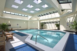 Indoor pool, open 9:00 AM to 9:00 PM, pool loungers