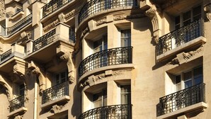 A multi-story building with ornate balconies and classical architectural details. - Hôtel Sezz Paris (Paris)