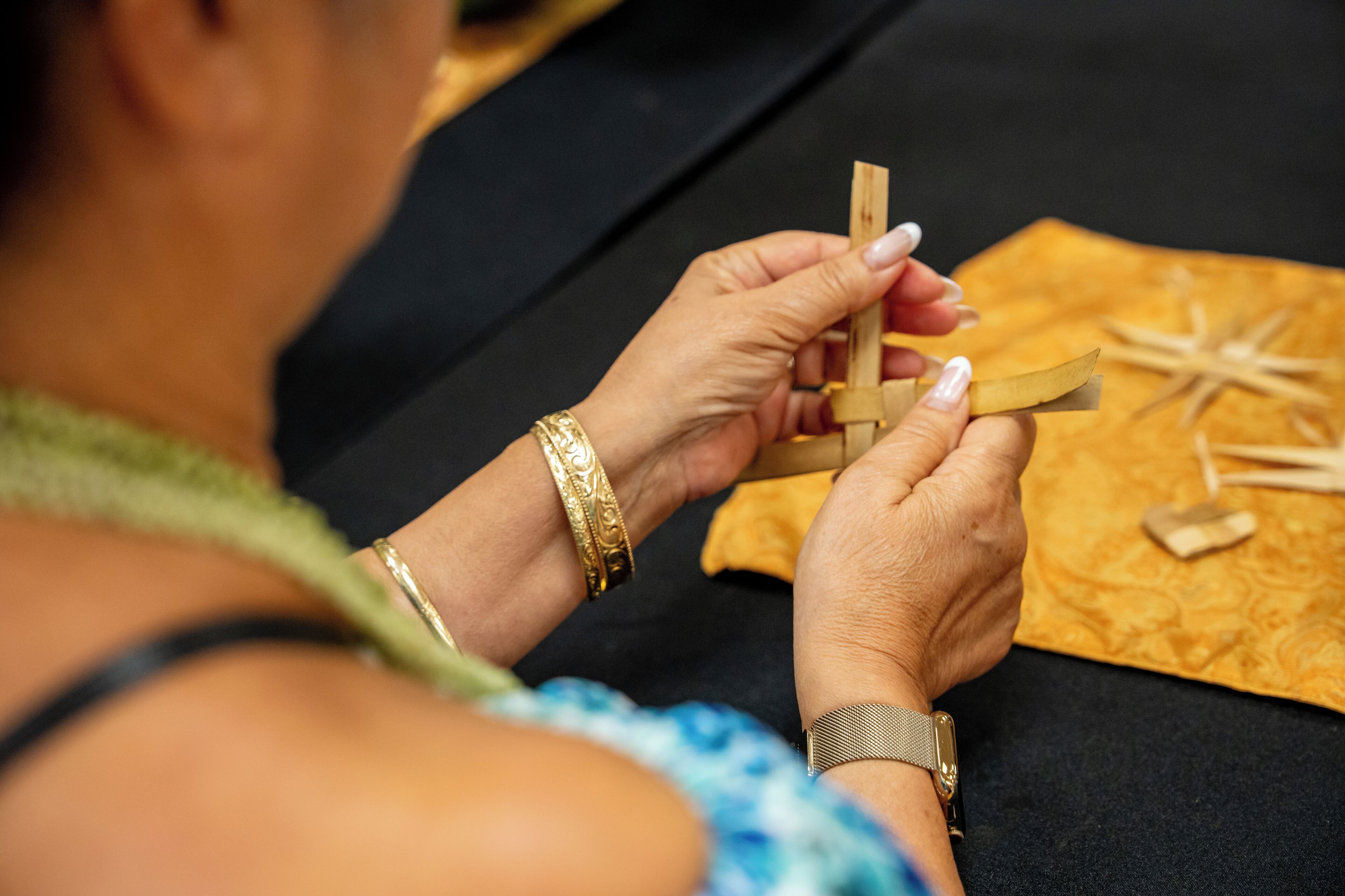 A person assembling a wooden structure.