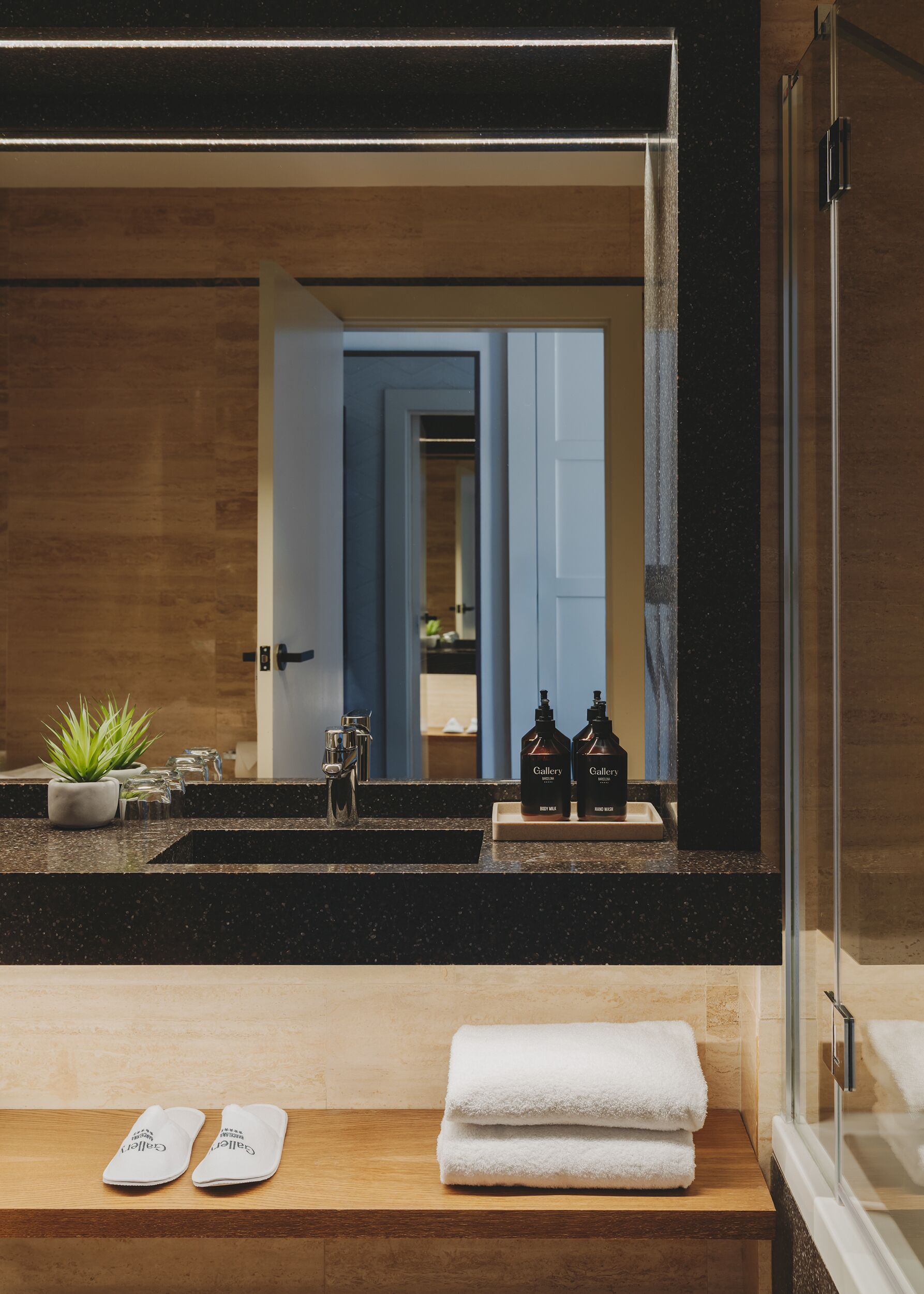 designer toiletries, hair dryer, slippers, bidet