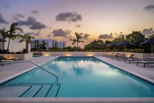 Outdoor pool, open 6:00 AM to 8:00 PM, pool umbrellas, pool loungers