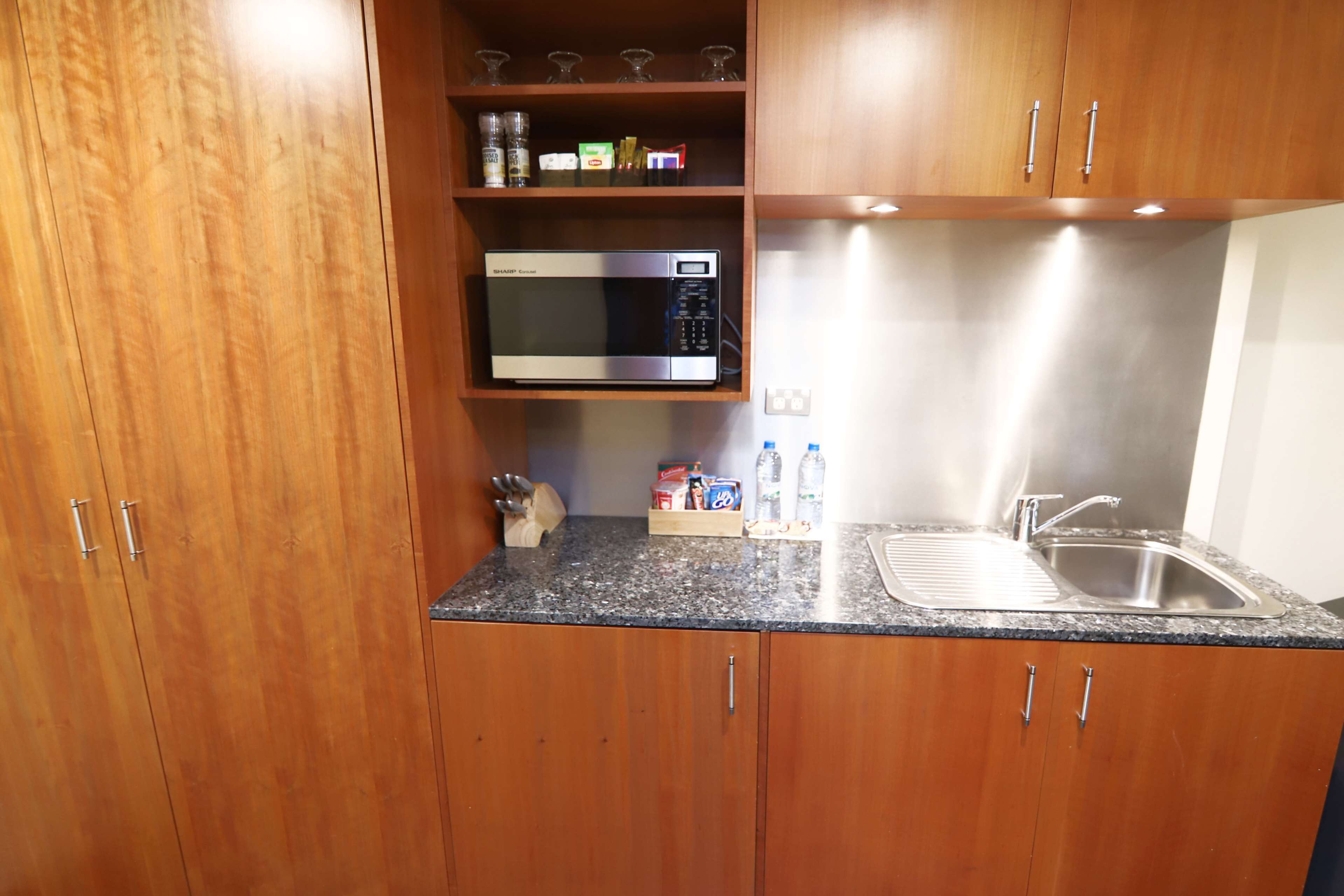 superior room, 2 queen beds, kitchenette, ground floor | premium bedding, pillow-top beds, minibar, in-room safe