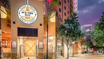 A building with a prominent sign for 'New York West Pints & Sports.'