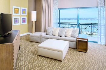 Luxury Suite, 1 King Bed | Living area | 42-inch LCD TV with satellite channels, TV, video-game console at Embassy Suites by Hilton San Diego Bay Downtown