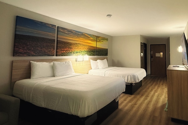 Deluxe Room, 2 Queen Beds, Non Smoking | In-room safe, desk, cribs (surcharge), rollaway beds (surcharge)