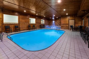 An indoor swimming pool with tiled flooring and wooden walls. - Days Inn by Wyndham Mankato (Mankato)